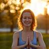 Woman enjoying outdoor yoga, representing mental well-being